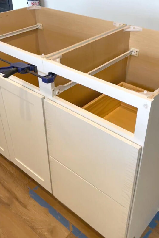 Attaching kitchen cabinets to each other, while building a waterfall kitchen island.